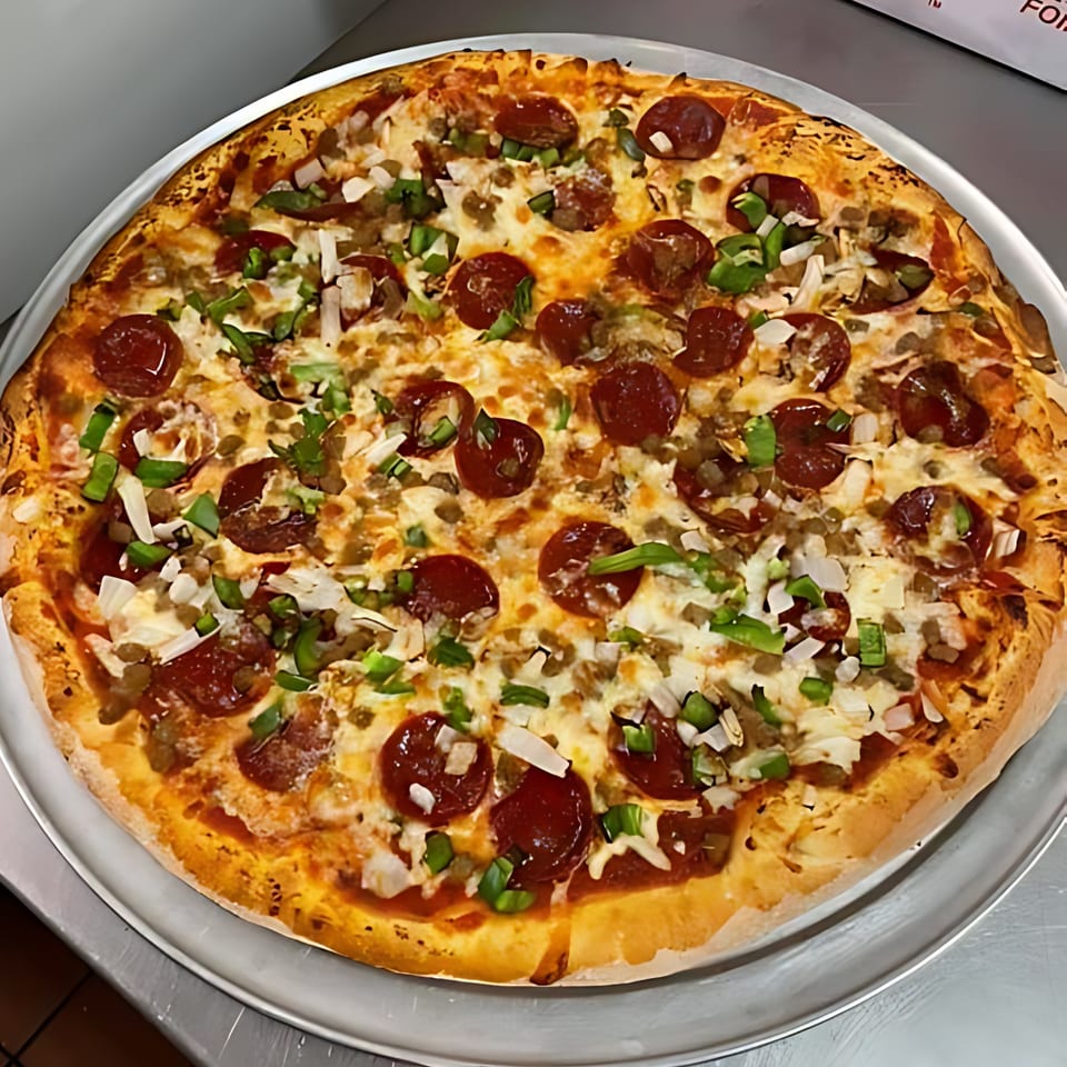 A large, round Sammy's Italian pizza with pepperoni, sausage, green peppers, and onions.